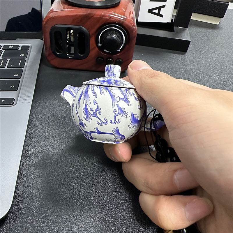 Blue and white porcelain teapot lighter with pink flame, refillable lighter