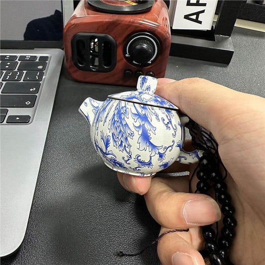 Blue and white porcelain teapot lighter with pink flame, refillable lighter